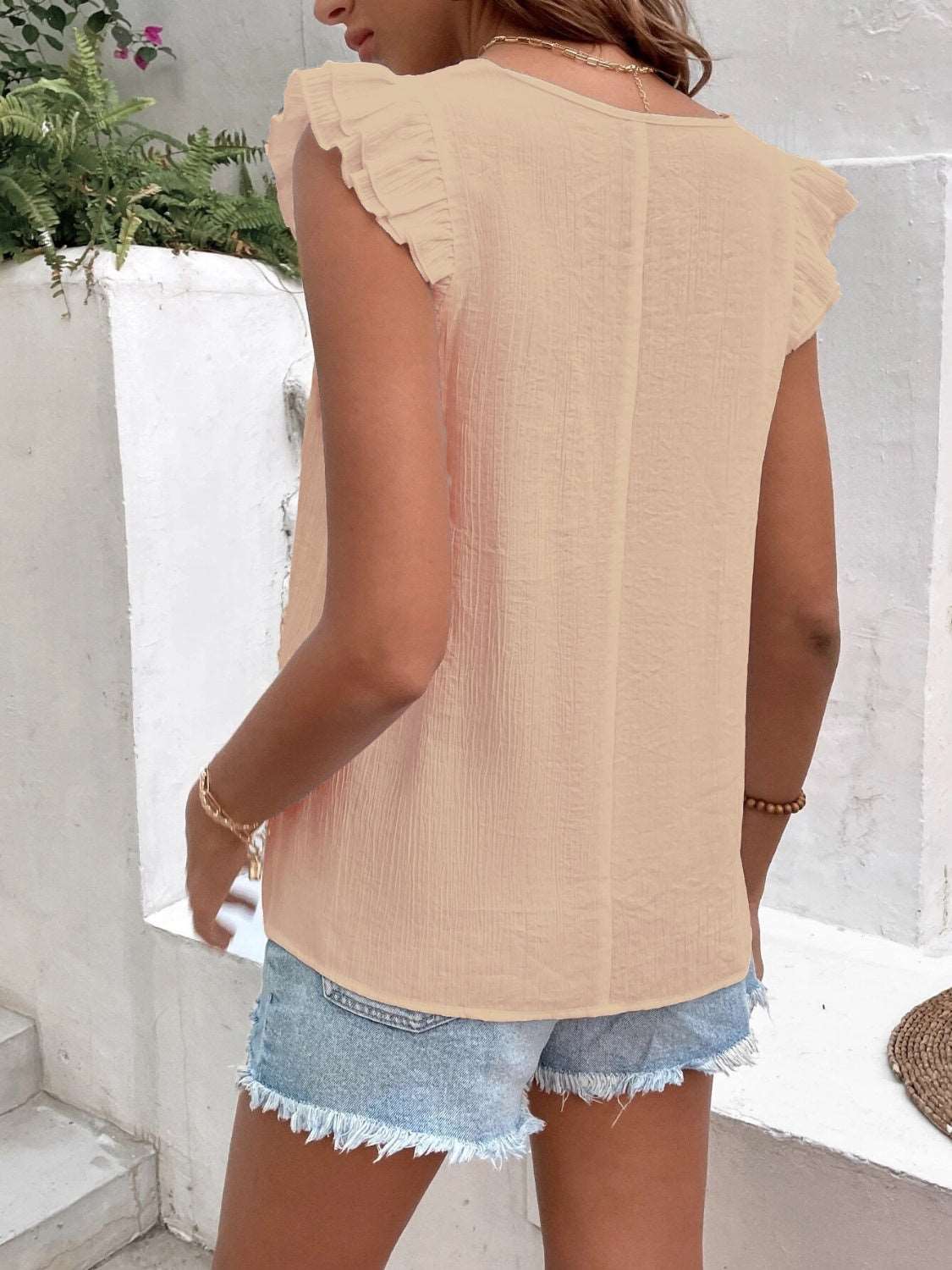 A Ruffled V-Neck Cap Sleeve Blouse